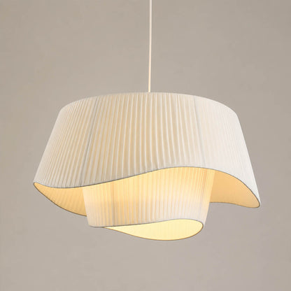 Plisse pleated pendant light beige fabric drum shade hand pleated sculptural modern white background front view