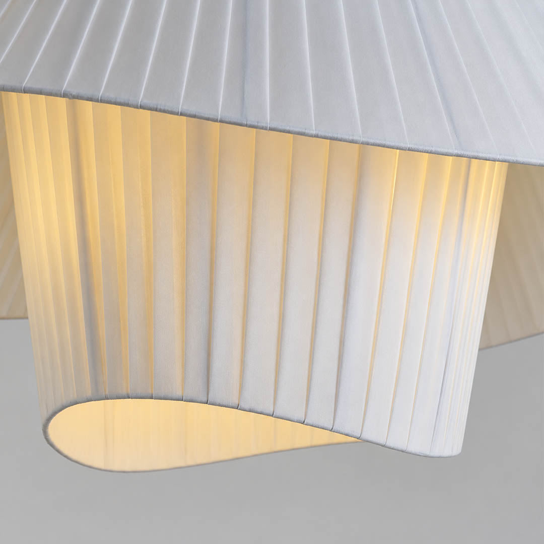 Plisse pleated pendant light hand pleated plisse fabric texture folds craftsmanship detail close up premium