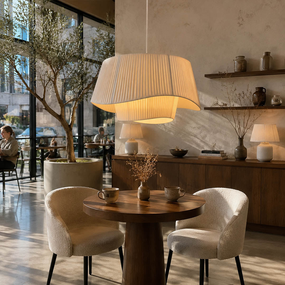 Plisse pleated pendant light boutique restaurant cafe multiple pleated fabric shades warm ambient hospitality American commercial interior