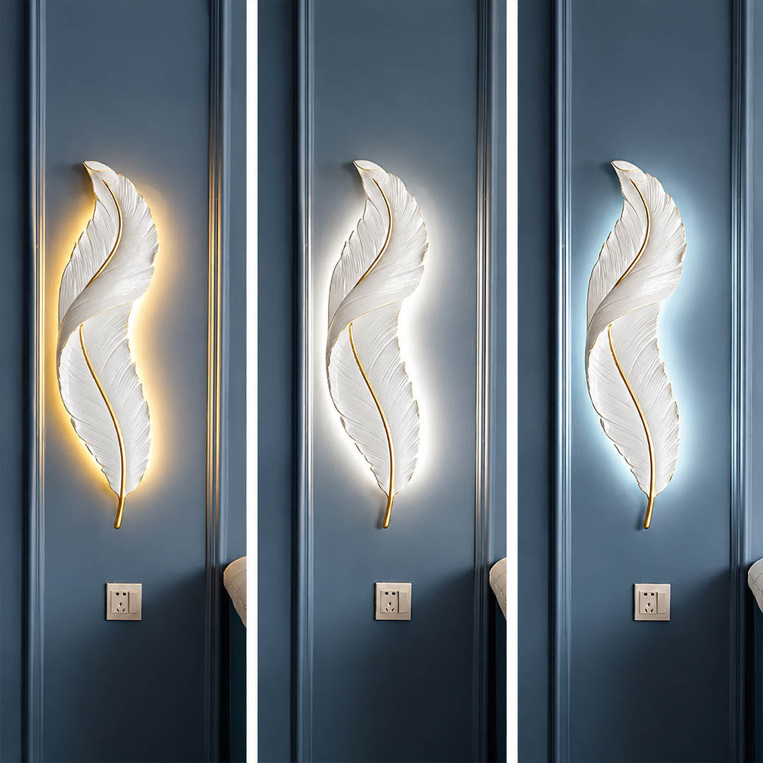 Plume feather wall sconce illuminated three color temperature warm neutral cool white gold resin art deco glow white background