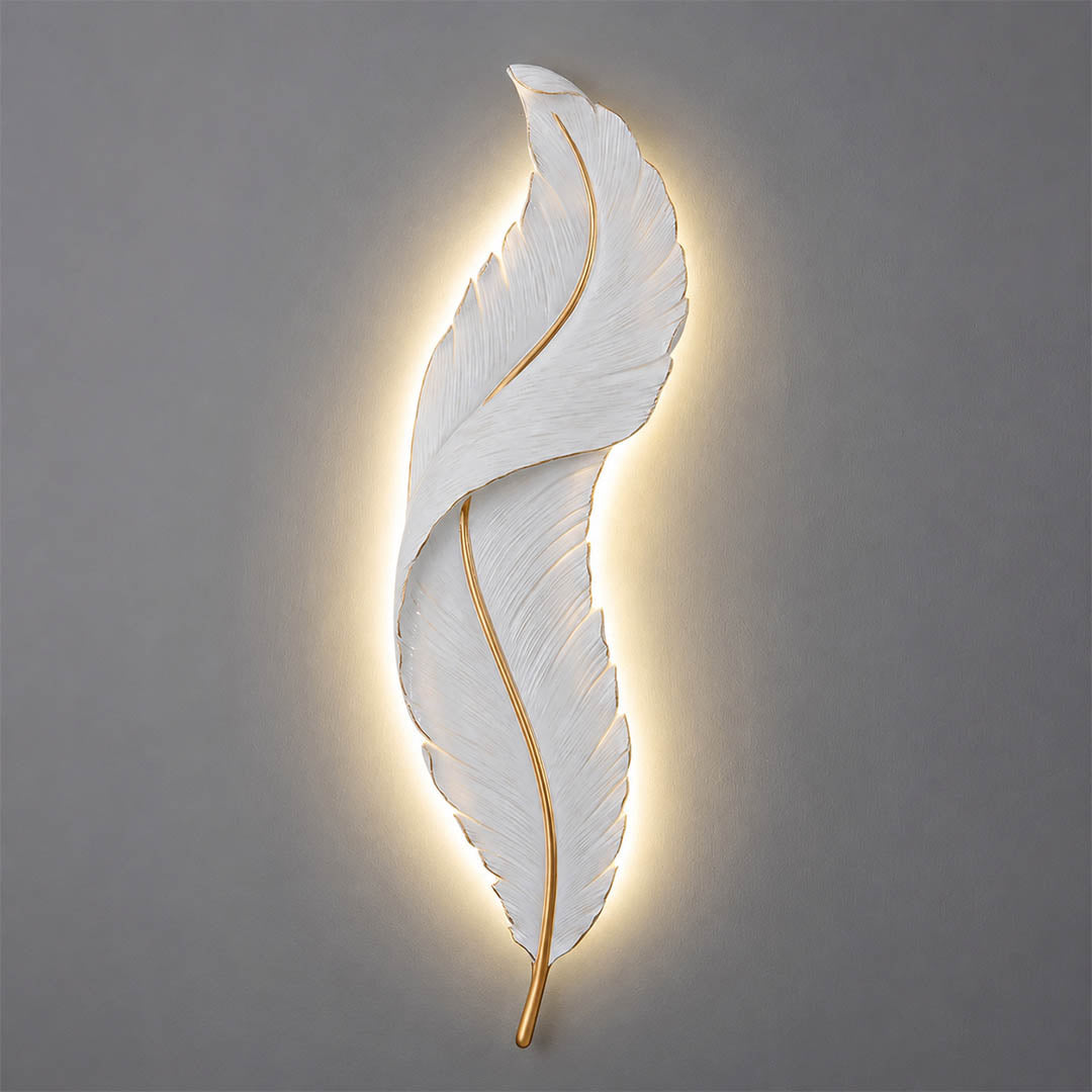 Plume feather wall sconce illuminated three color temperature warm neutral cool white gold resin art deco glow white background