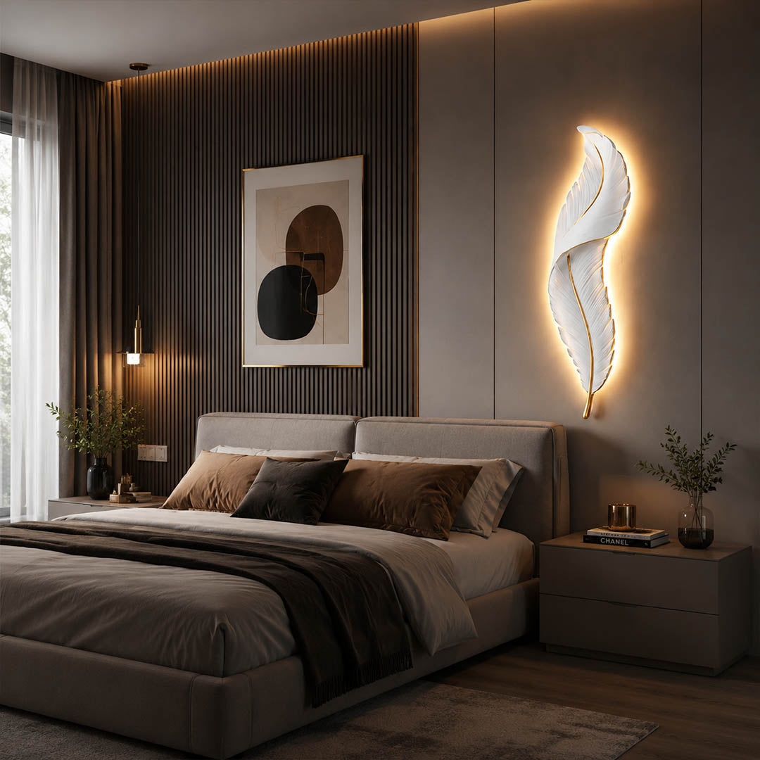 Plume feather wall sconce white gold bedroom bedside illuminated soft warm feather glow art deco calming American home lifestyle interior