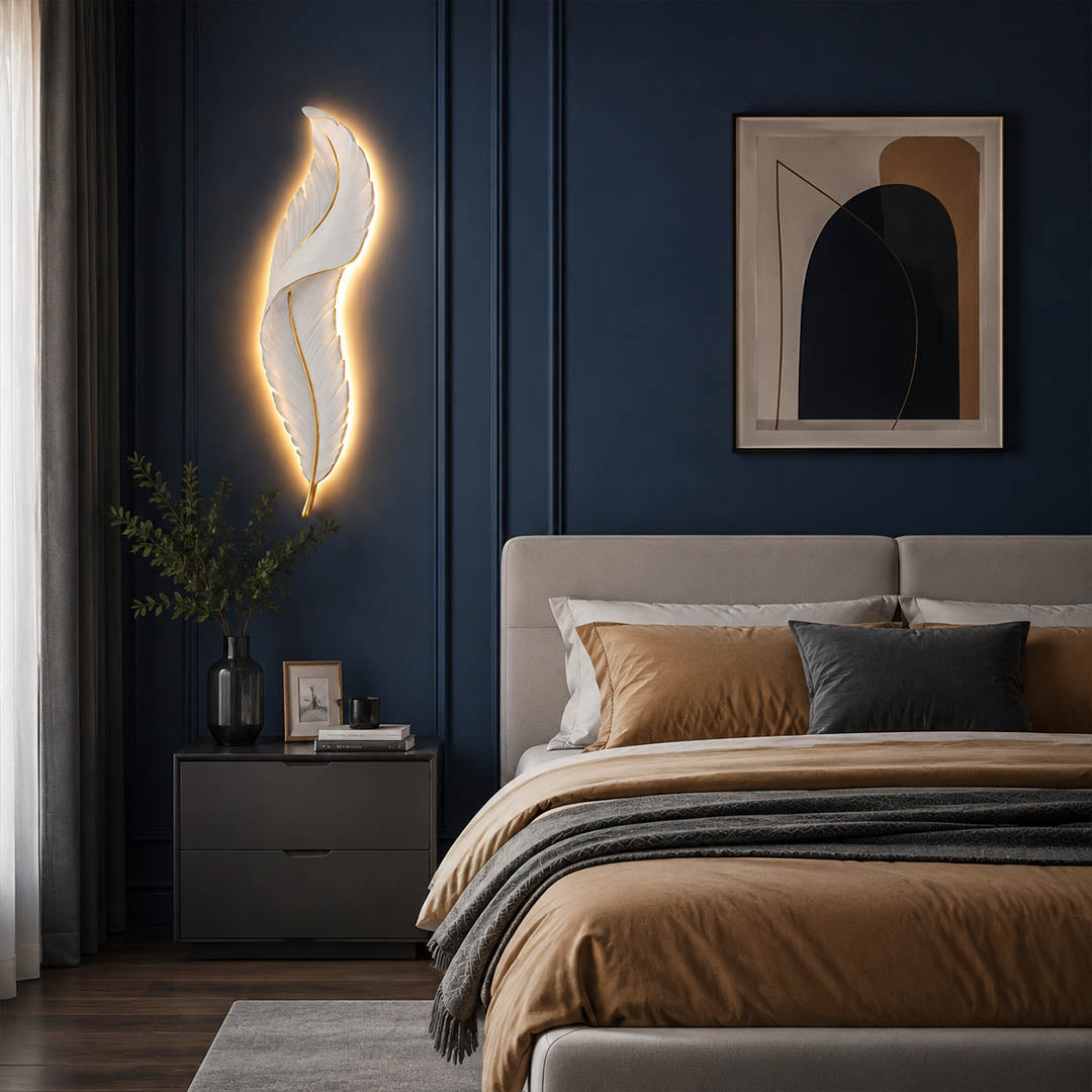 Plume feather wall sconce white gold bedroom bedside illuminated soft warm feather glow art deco calming American home lifestyle interior