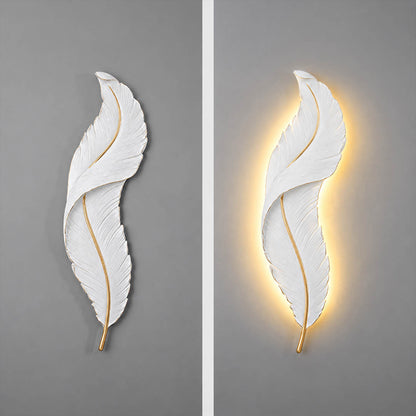 Plume feather wall sconce illuminated glowing feather silhouette soft warm ambient light art deco resin evening mood detail close up