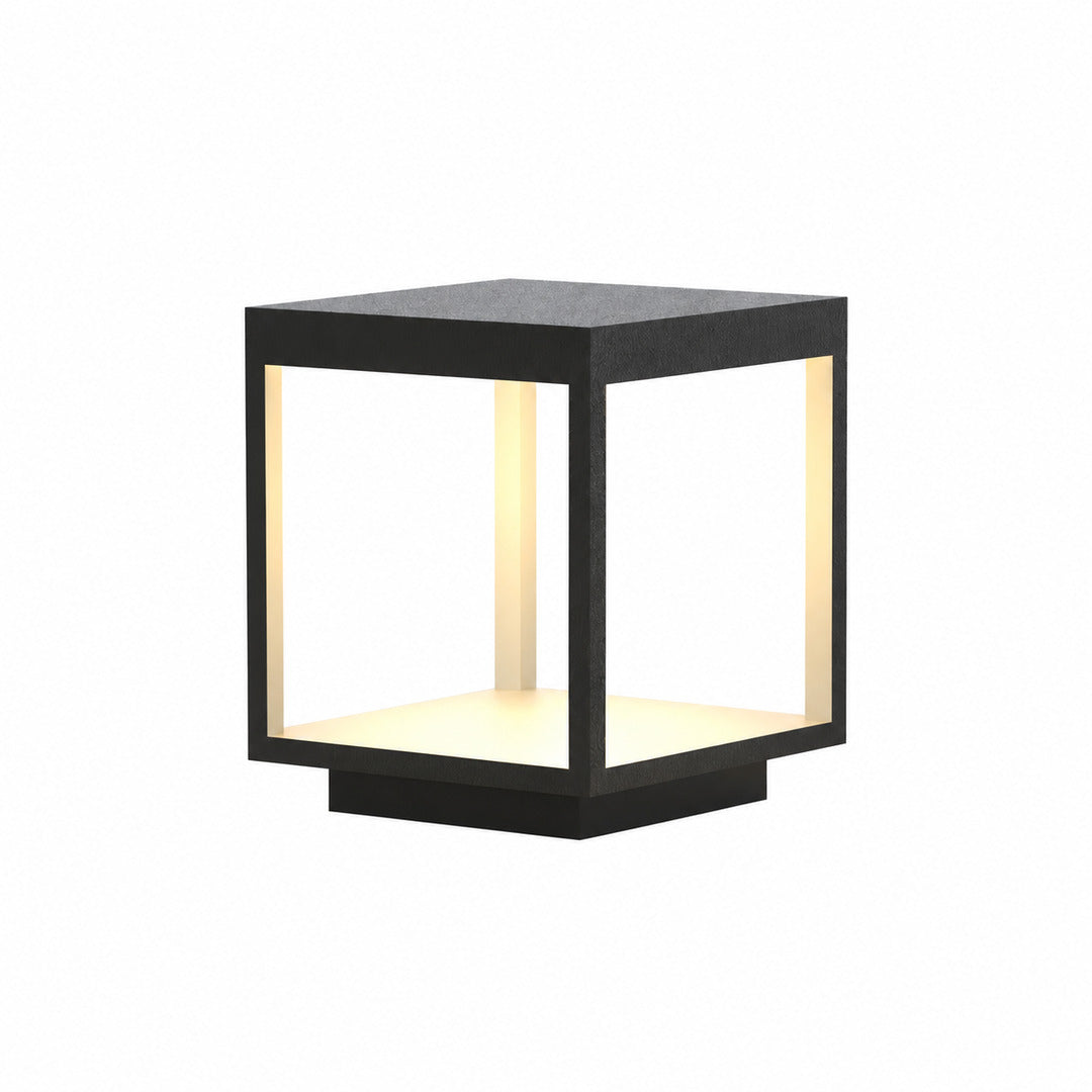 Quadro outdoor post light with a modern square stainless steel frame glowing warm on a garden fence post