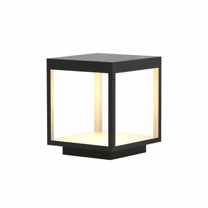Quadro outdoor post light with a modern square stainless steel frame glowing warm on a garden fence post