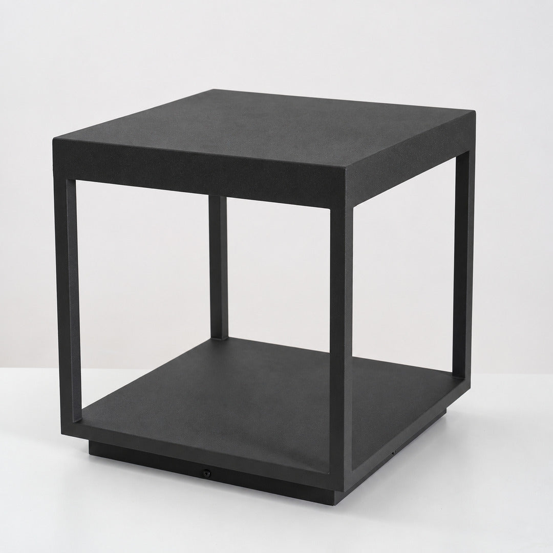 Close-up of the square stainless steel frame and acrylic diffuser of the Quadro outdoor post light