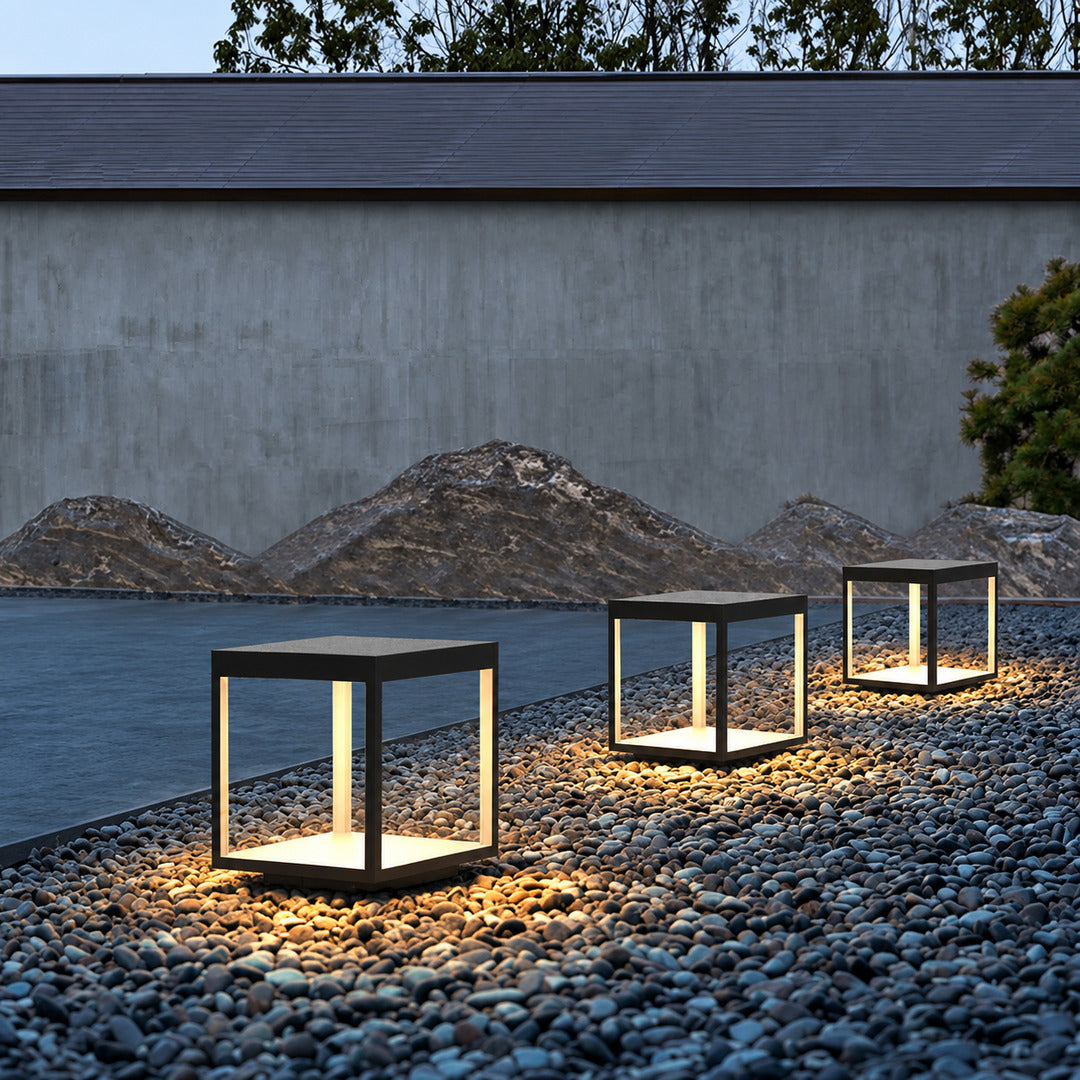 Quadro outdoor post lights lighting a bed and breakfast courtyard with a warm glow