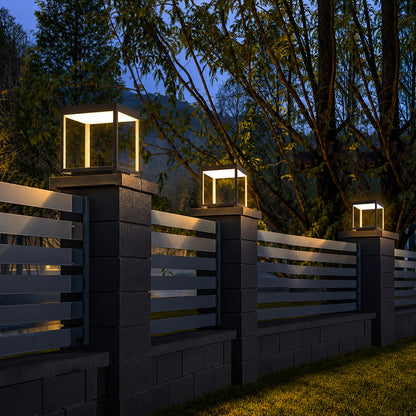Quadro outdoor post lights lining a pool surround with a warm modern glow
