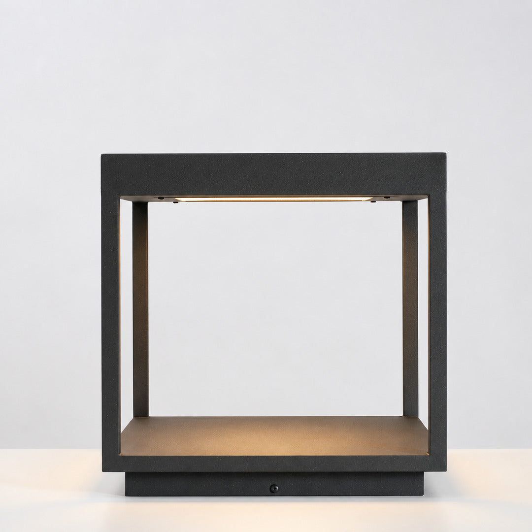 Close-up of the square stainless steel frame and acrylic diffuser of the Quadro outdoor post light