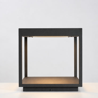 Close-up of the square stainless steel frame and acrylic diffuser of the Quadro outdoor post light