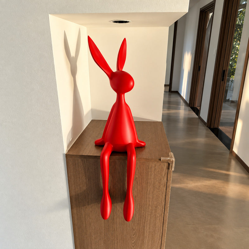 Rabbit resin sculpture welcoming guests as a decorative accent on an entryway console