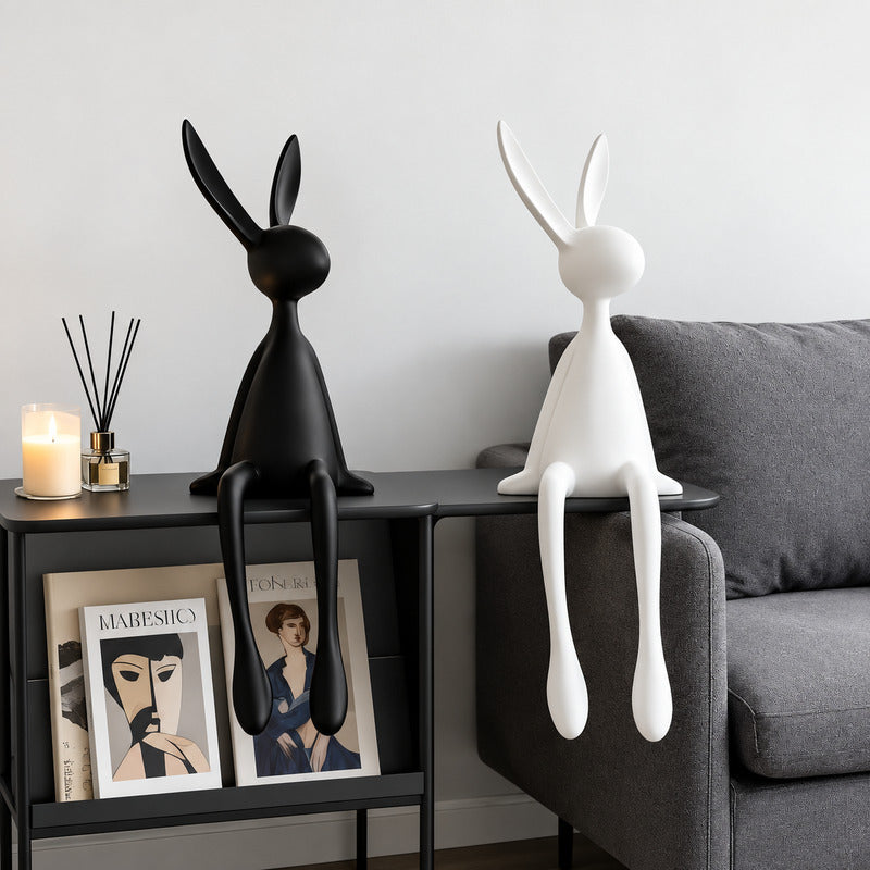 Rabbit resin sculpture styled as a decorative accent on a modern living room bookshelf