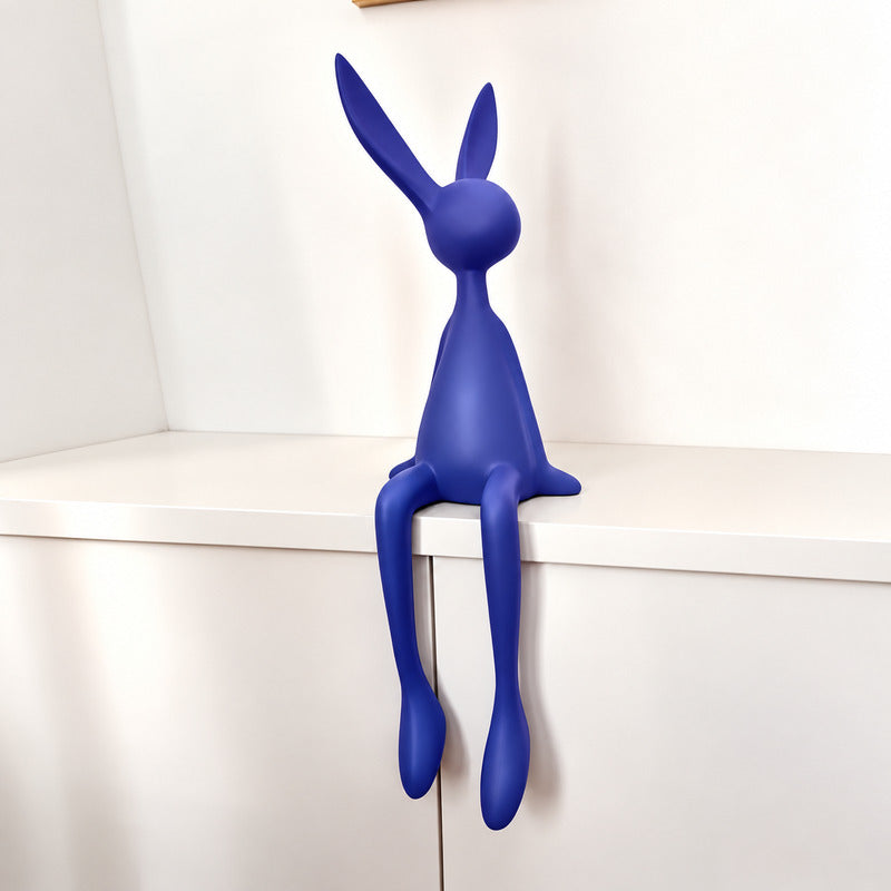 Small 19.7-inch blue rabbit resin sculpture on a nightstand