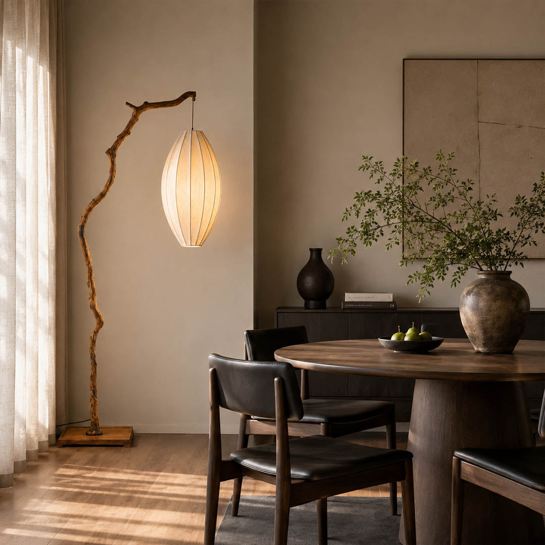Ramo floor lamp brown modern dining room corner adjacent sculptural tree branch resin frame Japandi wabi-sabi organic warm ambient evening entertaining sophisticated American home lifestyle interior