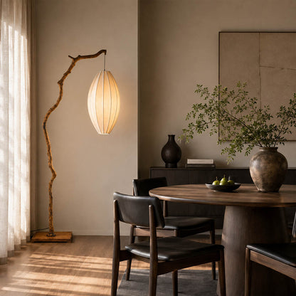Ramo floor lamp brown modern dining room corner adjacent sculptural tree branch resin frame Japandi wabi-sabi organic warm ambient evening entertaining sophisticated American home lifestyle interior