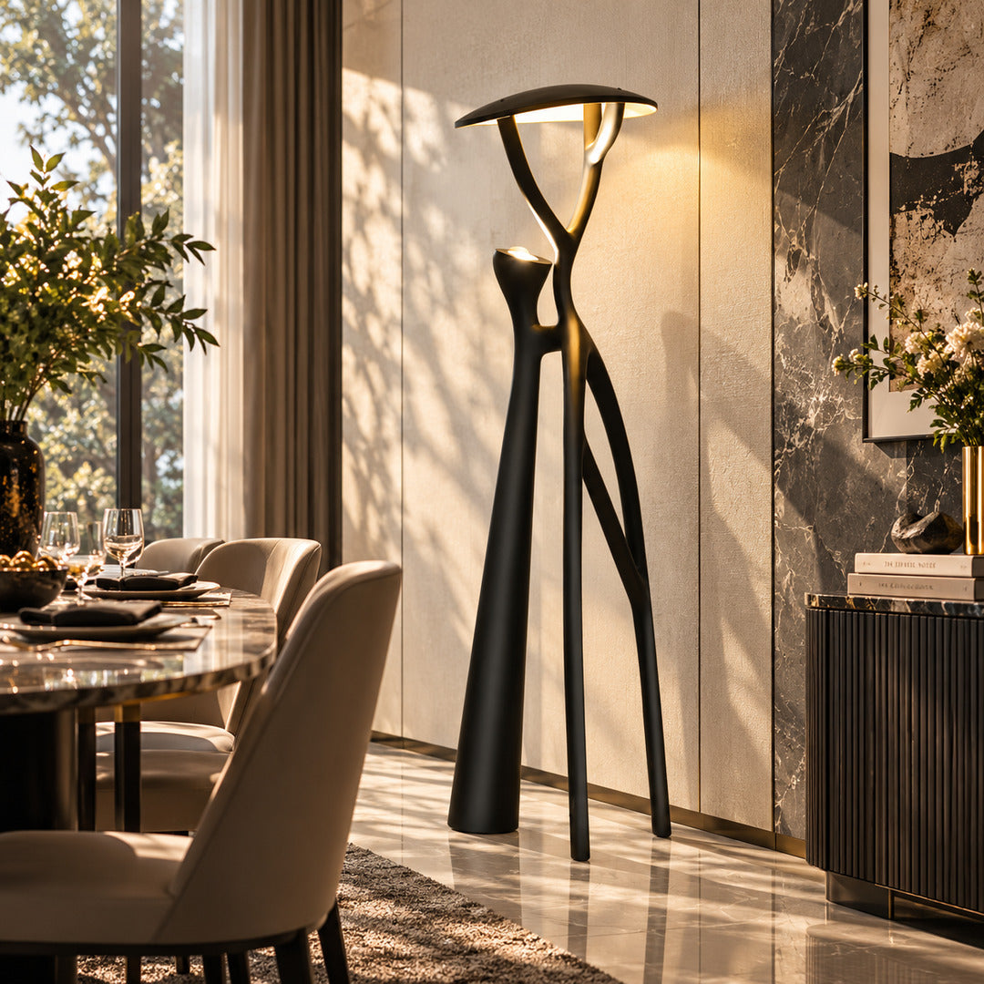 Ramo tree sculpture floor lamp filling a living room corner with a warm sculptural glow