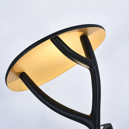 Warm soft light glowing from the top of the Ramo tree sculpture floor lamp