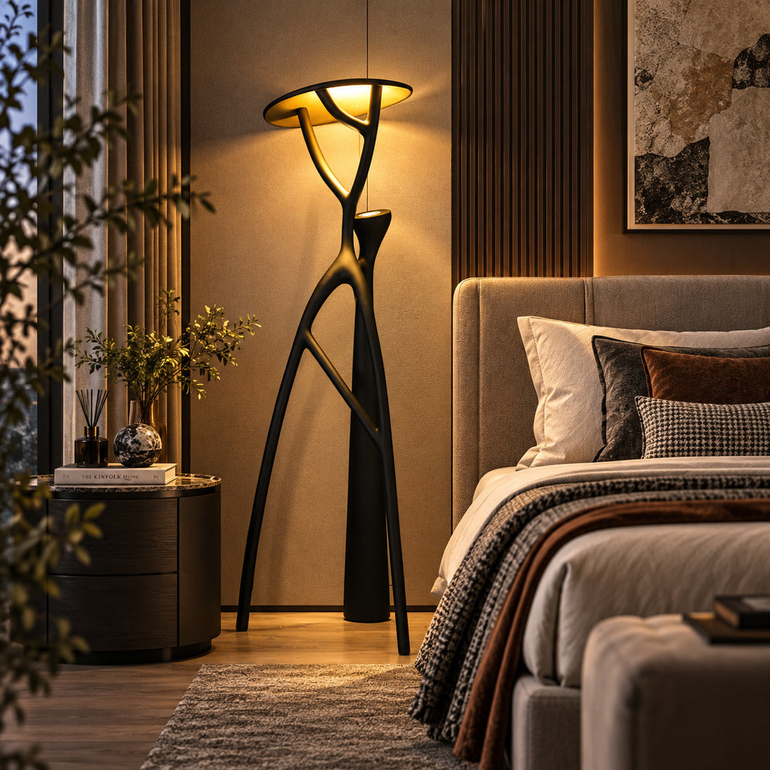 Ramo tree sculpture floor lamp adding a bold artistic accent beside a modern master bedroom bed