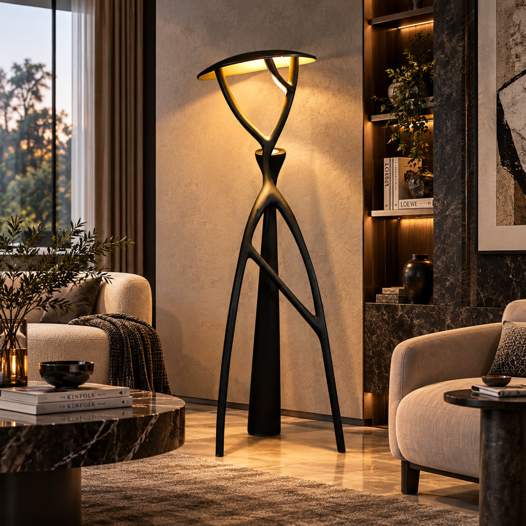 Ramo tree sculpture floor lamp standing beside a sofa as a dramatic centerpiece in a living room