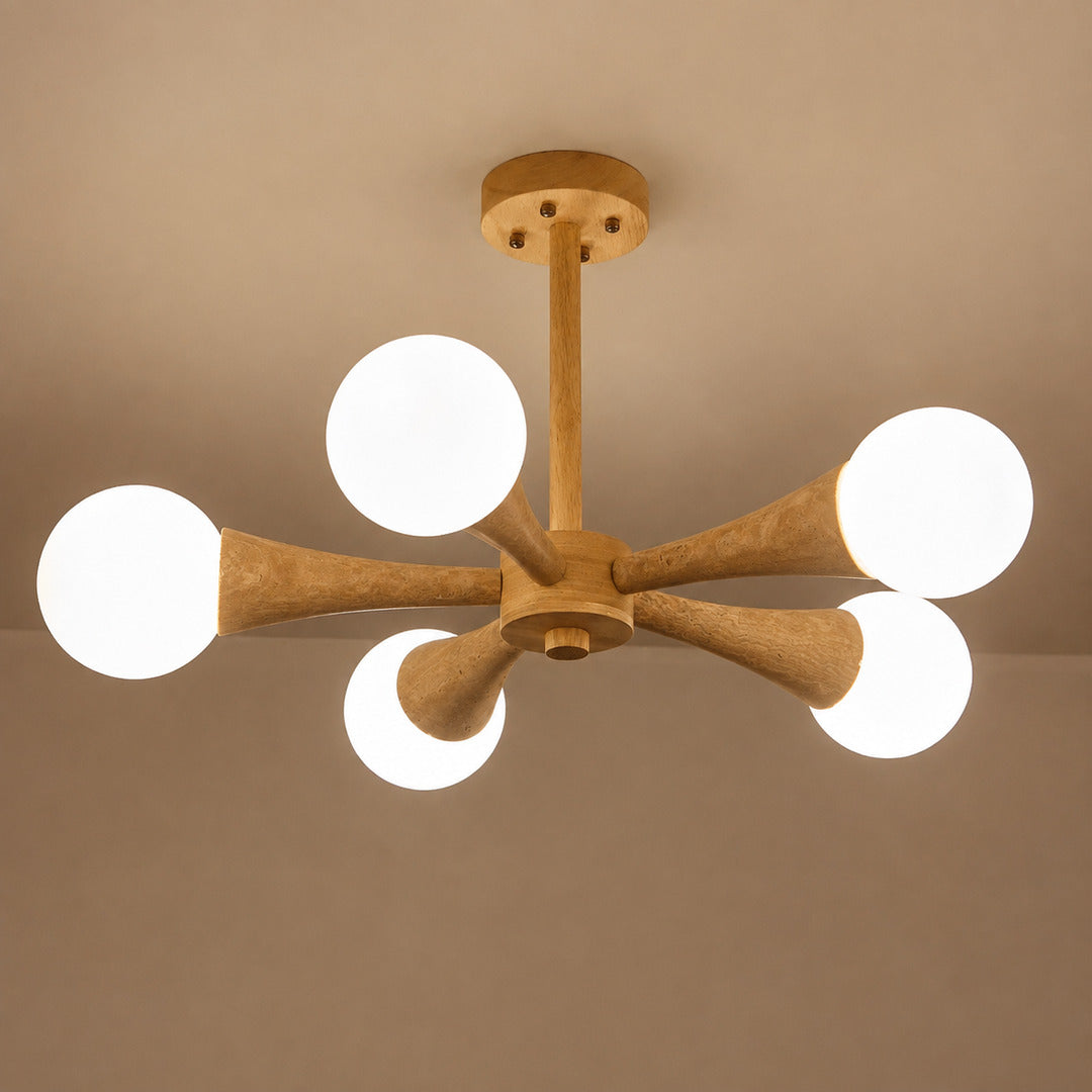 Ramo travertine chandelier illuminated warm glow travertine stone shades wood branching white background
