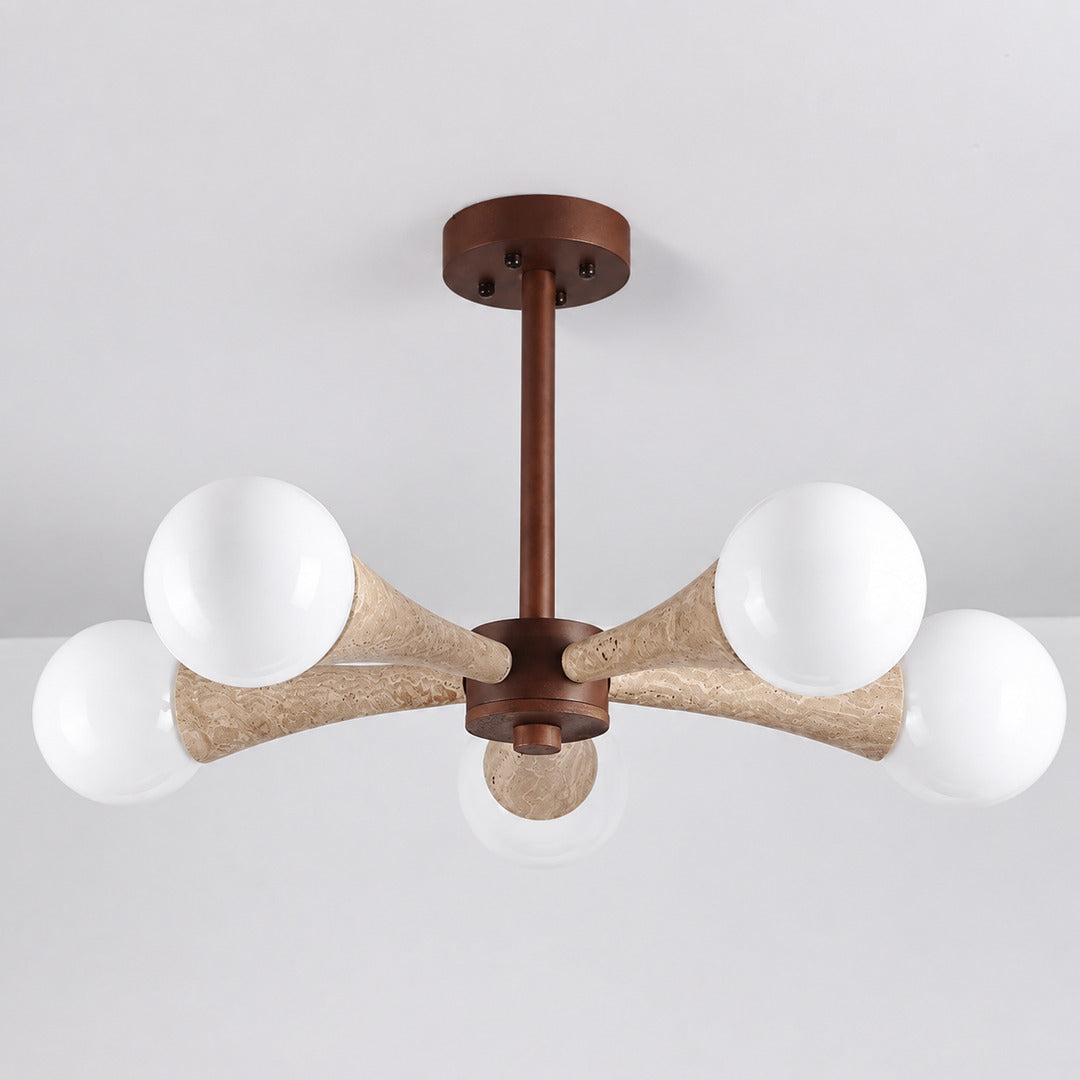 Ramo travertine chandelier illuminated warm light glowing through stone veining amber detail close up