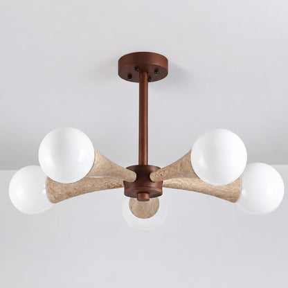 Ramo travertine chandelier illuminated warm light glowing through stone veining amber detail close up