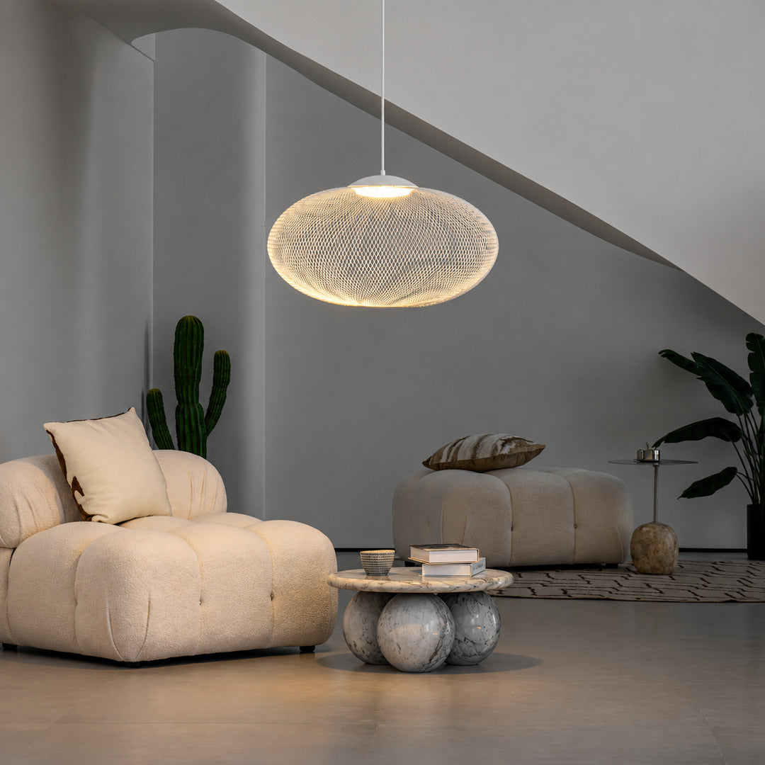 Reticella mesh pendant lights over a breakfast bar with a warm glow