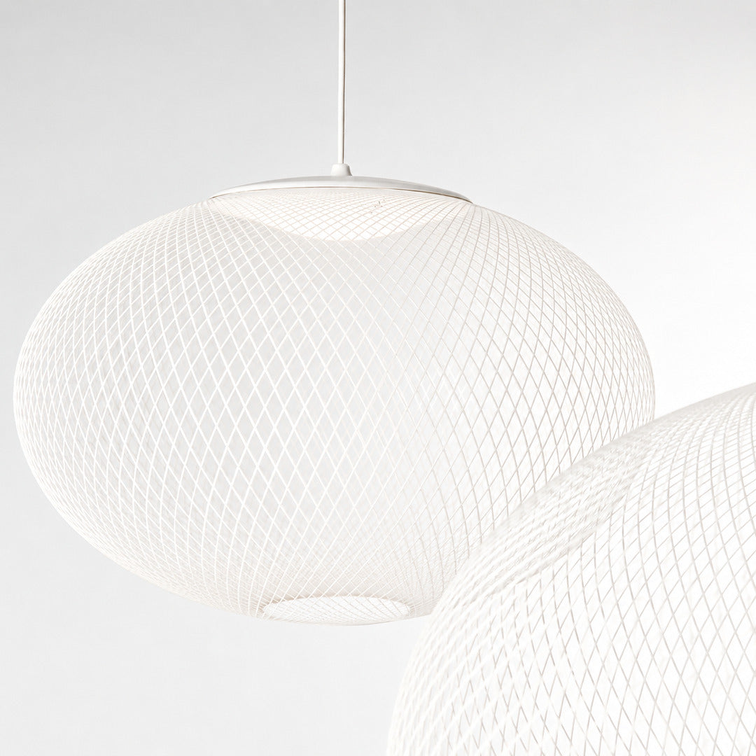 Close-up of the iron lattice meshwork shade of the Reticella pendant light
