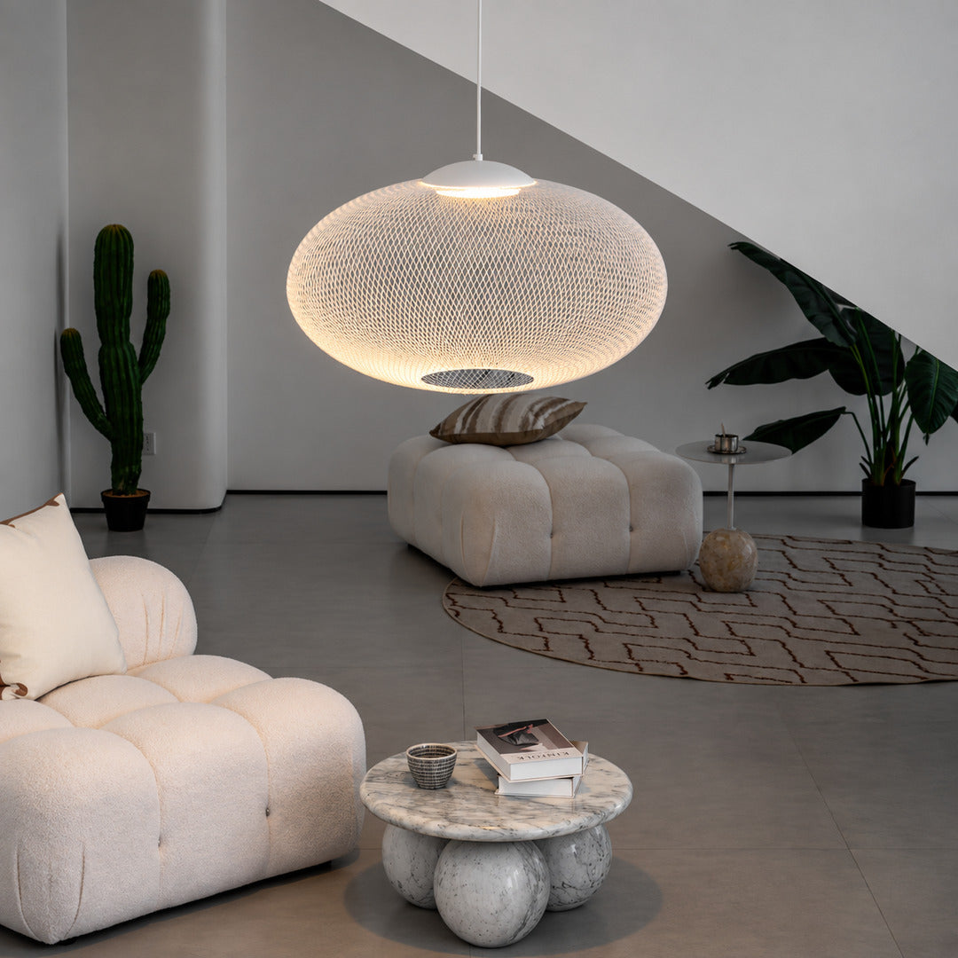 Reticella mesh pendant lights over a breakfast bar with a warm glow