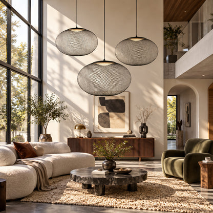 Large Reticella mesh pendant light as a sculptural centerpiece in a living room
