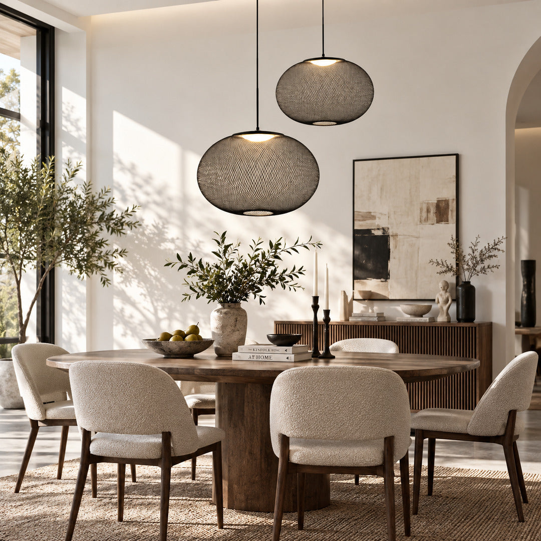 Reticella mesh pendant light casting a warm glow over a dining table