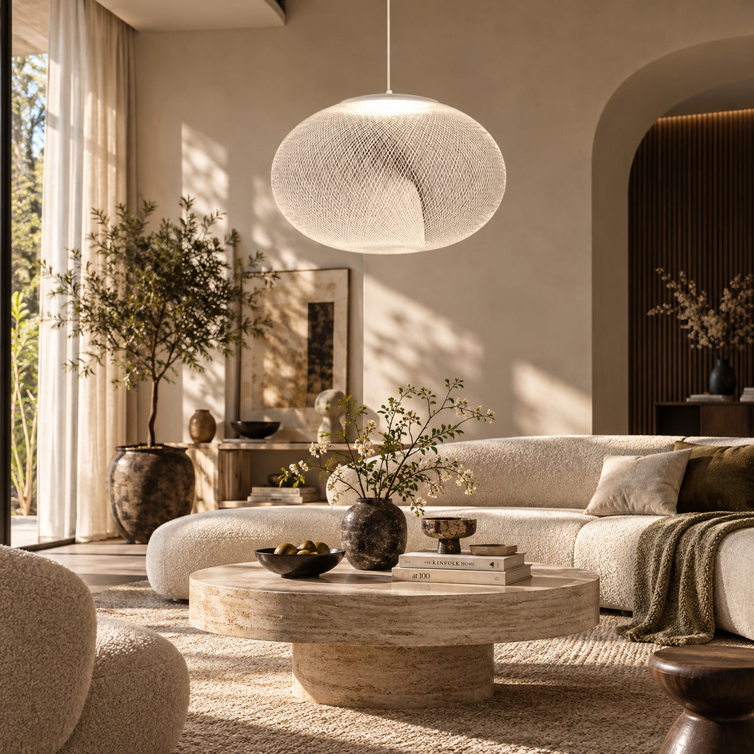 Large Reticella mesh pendant light as a sculptural centerpiece in a living room
