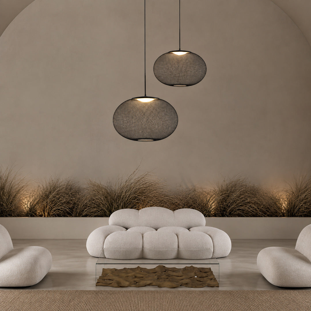Cluster of Reticella mesh pendant lights as a focal point in a modern hotel lobby