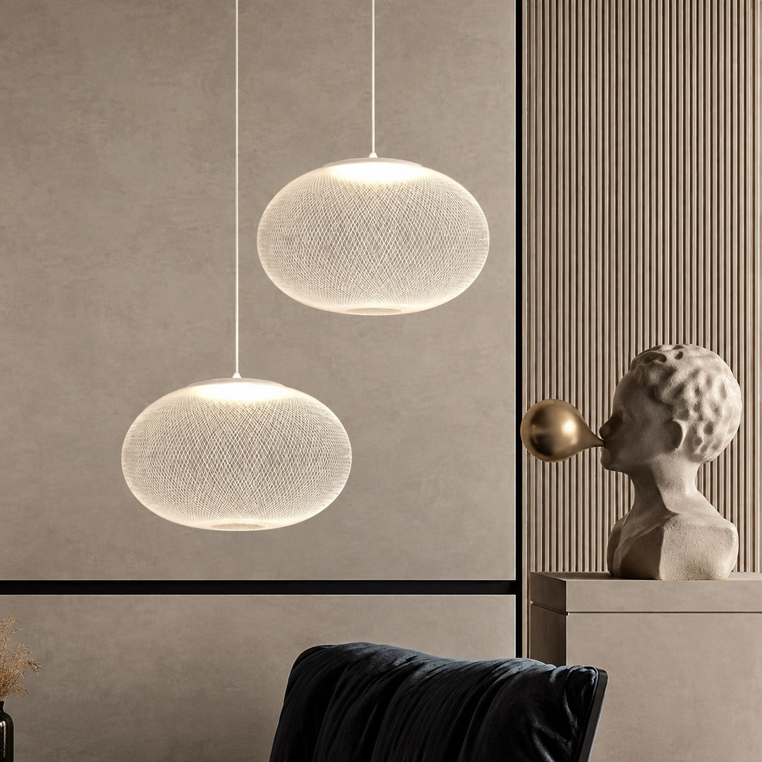 Cluster of Reticella mesh pendant lights as a focal point in a modern hotel lobby