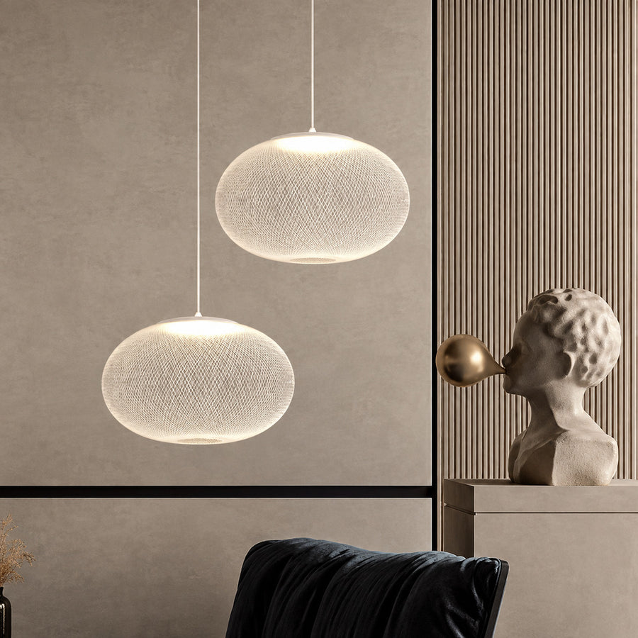 Cluster of Reticella mesh pendant lights as a focal point in a modern hotel lobby