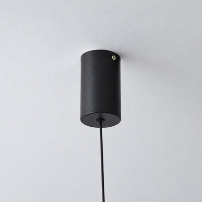 Slim ceiling mount holding the top of the Riga floor to ceiling lamp cable