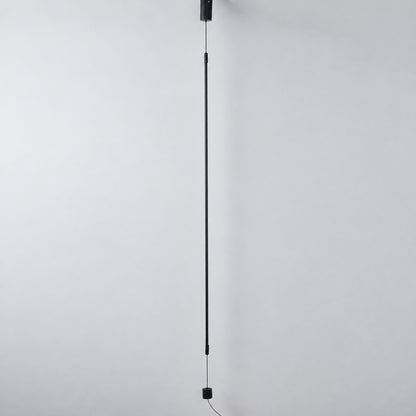 Riga LED tube lamp shown unlit as a fine black line and lit with a warm glow