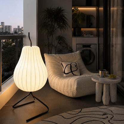 Rina silk pear floor lamp illuminated warm 2700K glow evening atmospheric silk shade translucent soft ambient serene detail close up bedside