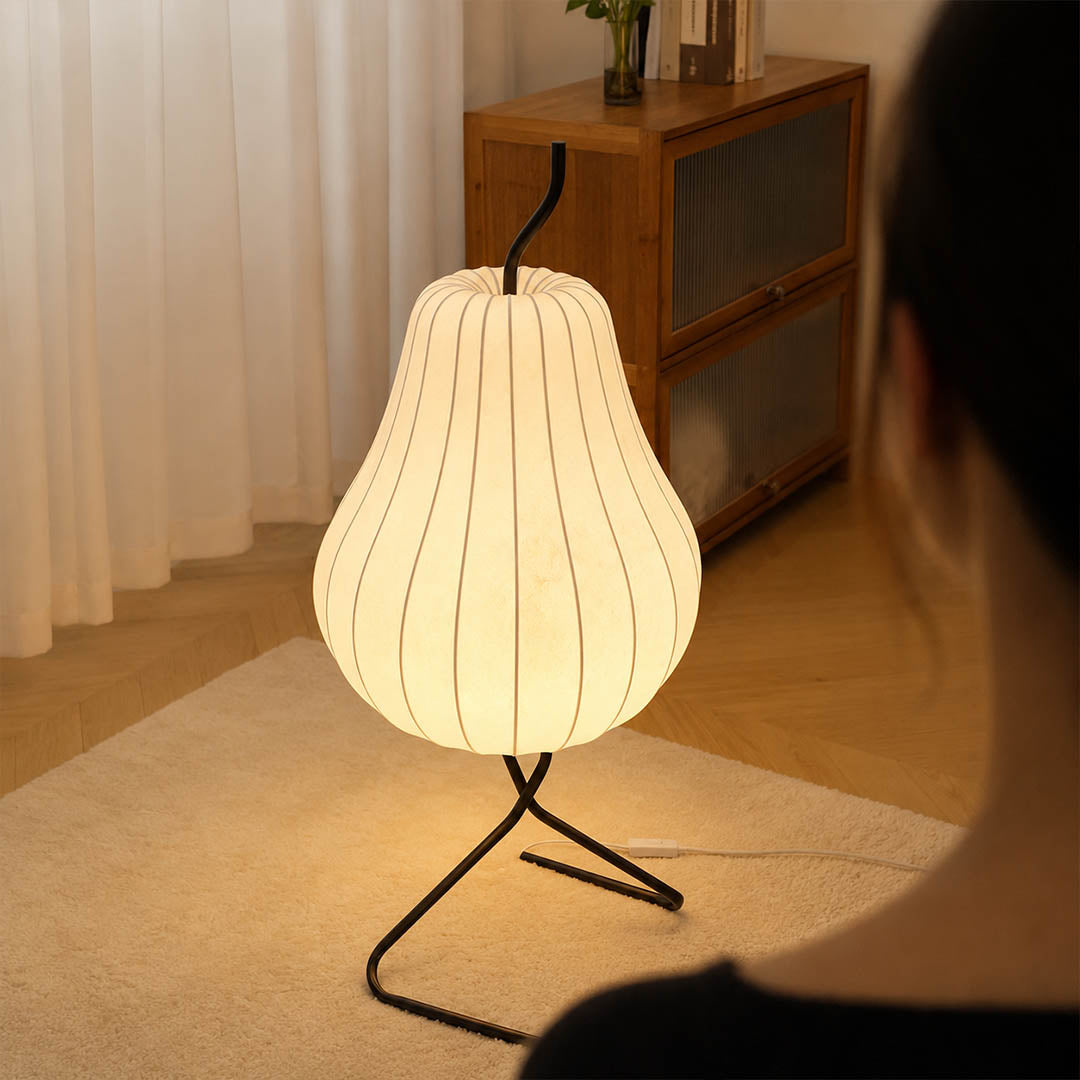 Rina silk pear table-height floor lamp Scandinavian living room corner white oak linen minimalist warm ambient soft glow lifestyle interior
