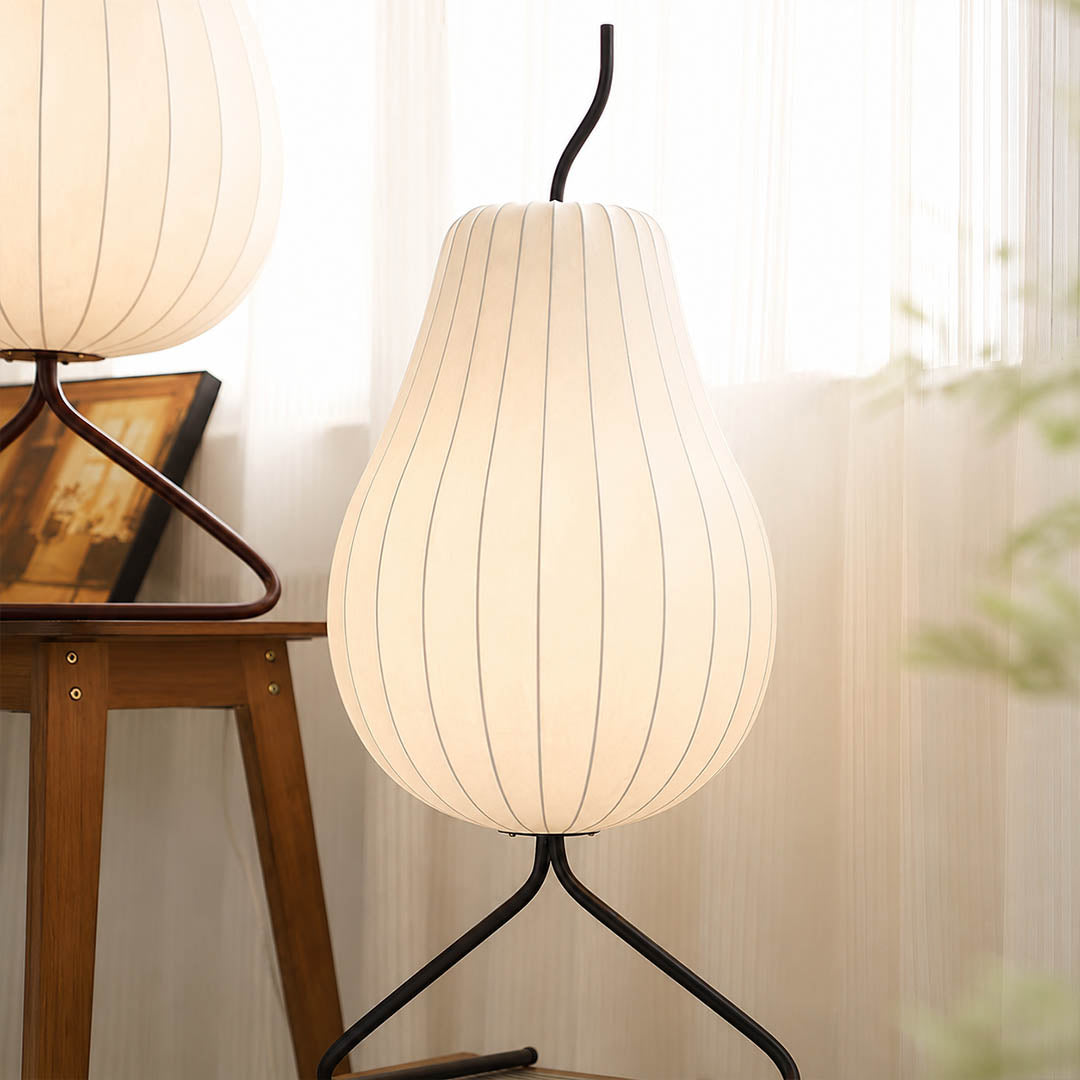Rina silk pear table-height floor lamp Scandinavian living room corner white oak linen minimalist warm ambient soft glow lifestyle interior