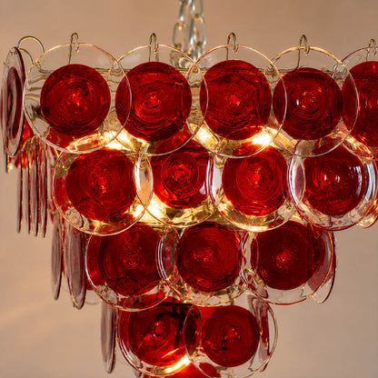 Ruby red Murano glass disc translucent hand blown Italian craftsmanship detail close up unique premium exclusive quality artisan French vintage