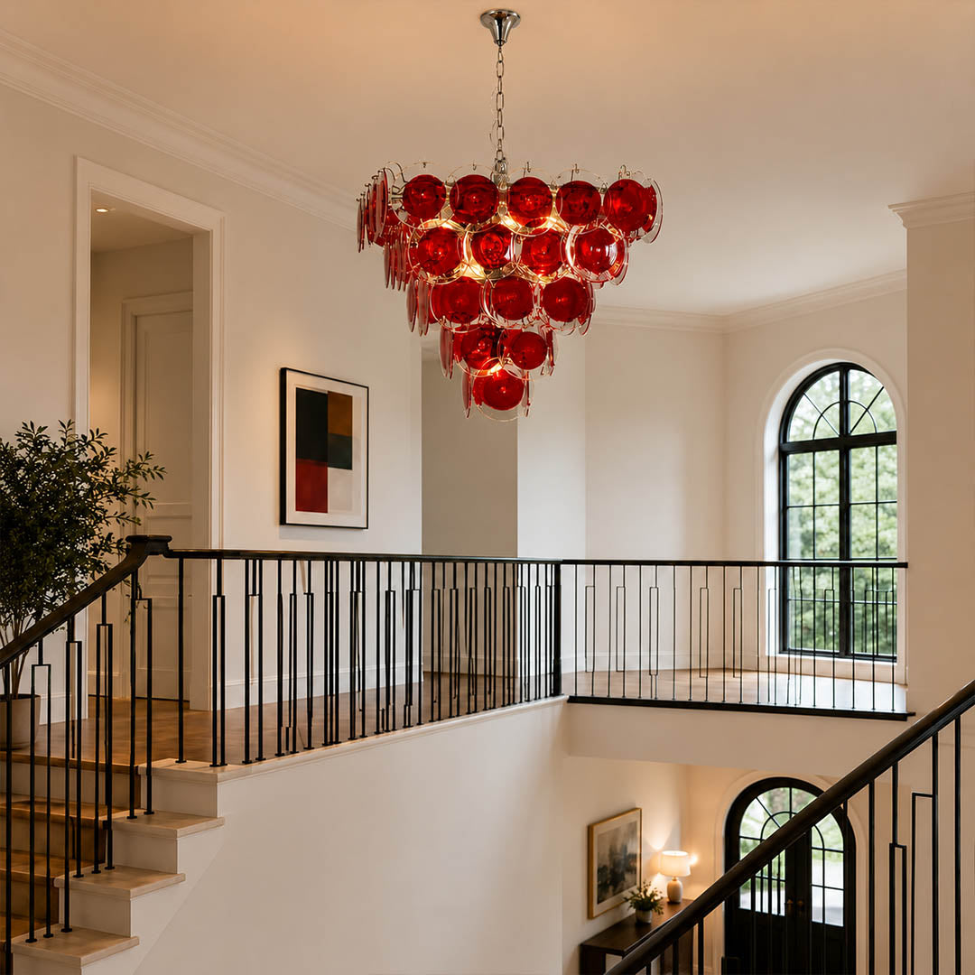 Ruby red pyramid Murano chandelier grand foyer double height mansion French vintage bold statement Italian sculptural warm glow lifestyle interior