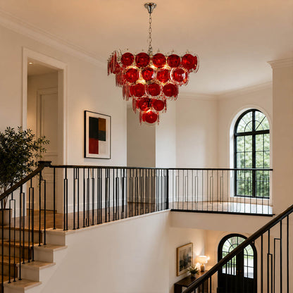 Ruby red pyramid Murano chandelier grand foyer double height mansion French vintage bold statement Italian sculptural warm glow lifestyle interior