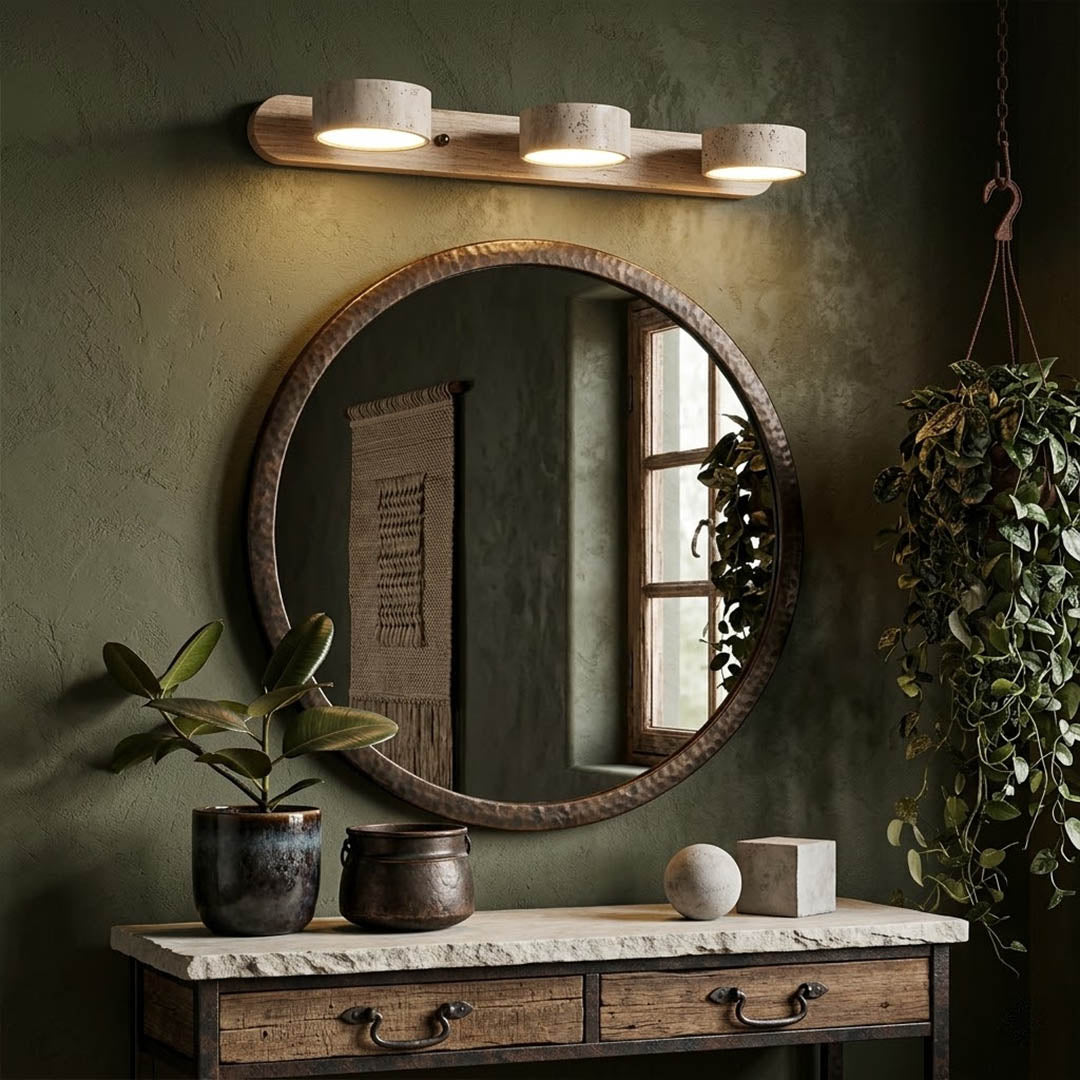 Saffron travertine vanity light above bathroom mirror warm stone glow modern interior