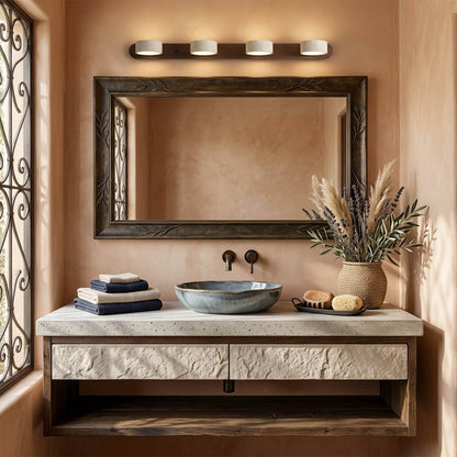 Saffron travertine vanity light above bathroom mirror warm stone glow modern interior