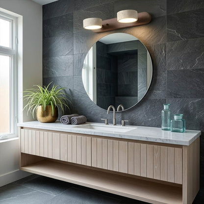 Saffron travertine vanity light above bathroom mirror warm stone glow modern interior