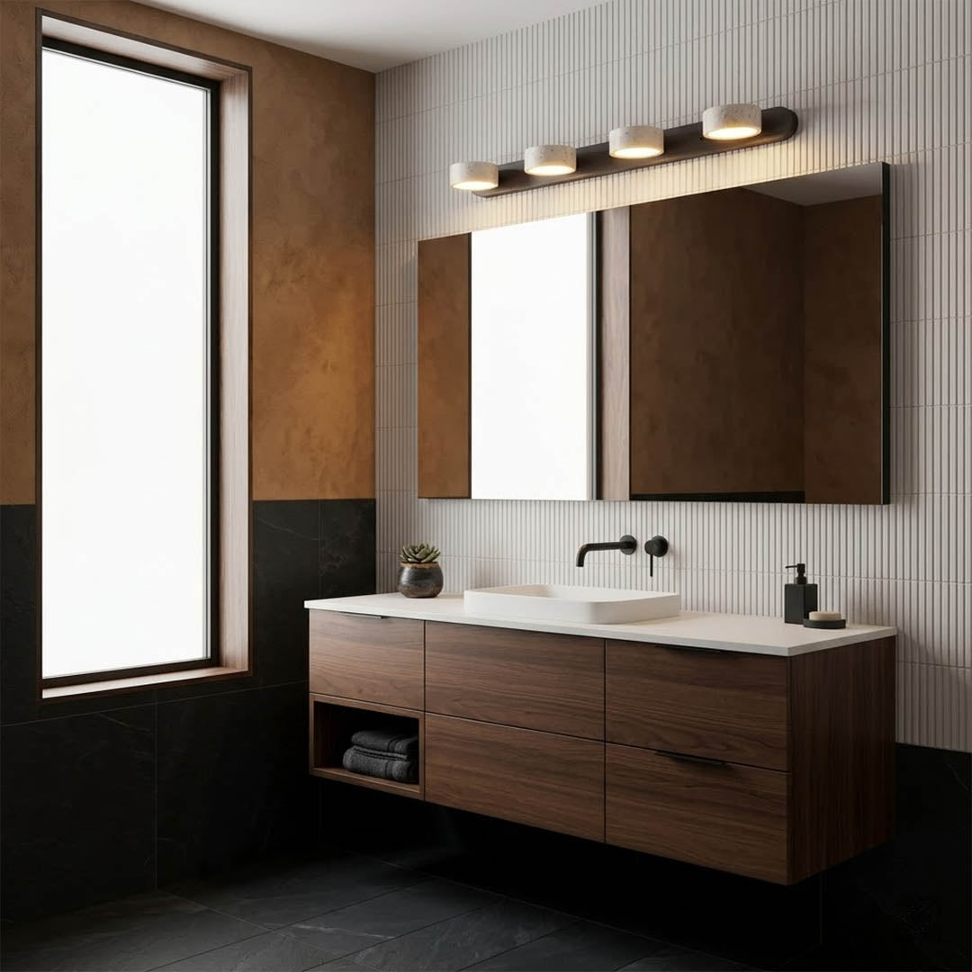 Saffron travertine vanity light above bathroom mirror warm stone glow modern interior