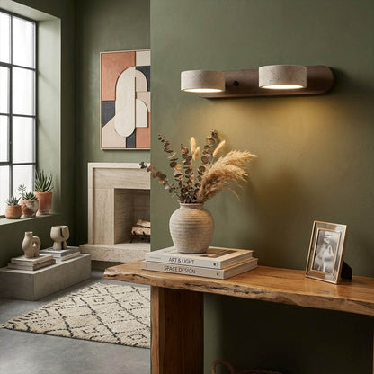 Saffron travertine vanity light above bathroom mirror warm stone glow modern interior