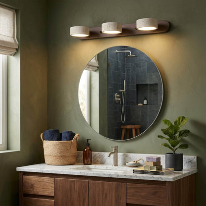 Saffron travertine vanity light above bathroom mirror warm stone glow modern interior